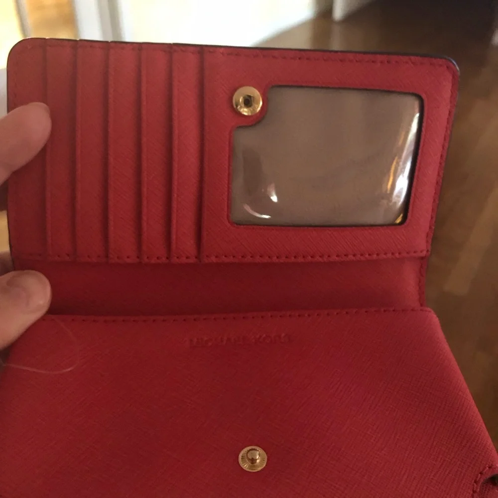 Michael Kors 6 slot wristlet in Beautiful coral 🪸 color, with zipper in back . - Picture 3 of 10